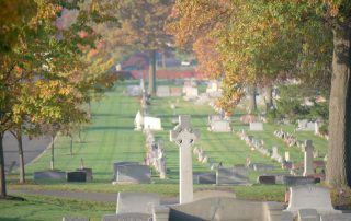 Cross monument with Autumn trees