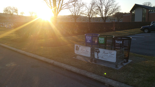 sustainability-1 Bright sun over colored recycling bins